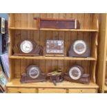 Six cased mantel and wall clocks and a cuckoo clock