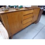 Teak sideboard with 4 central drawers and cupboards to the side