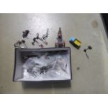 Box containing die cast figures and cars