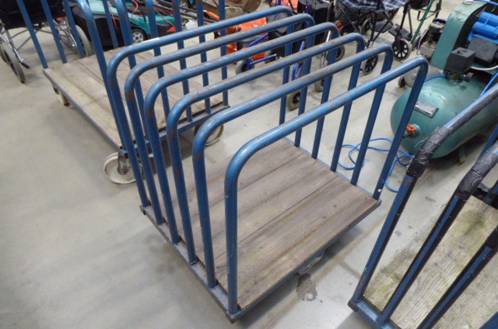 (53) 4 wheeled blue trolley