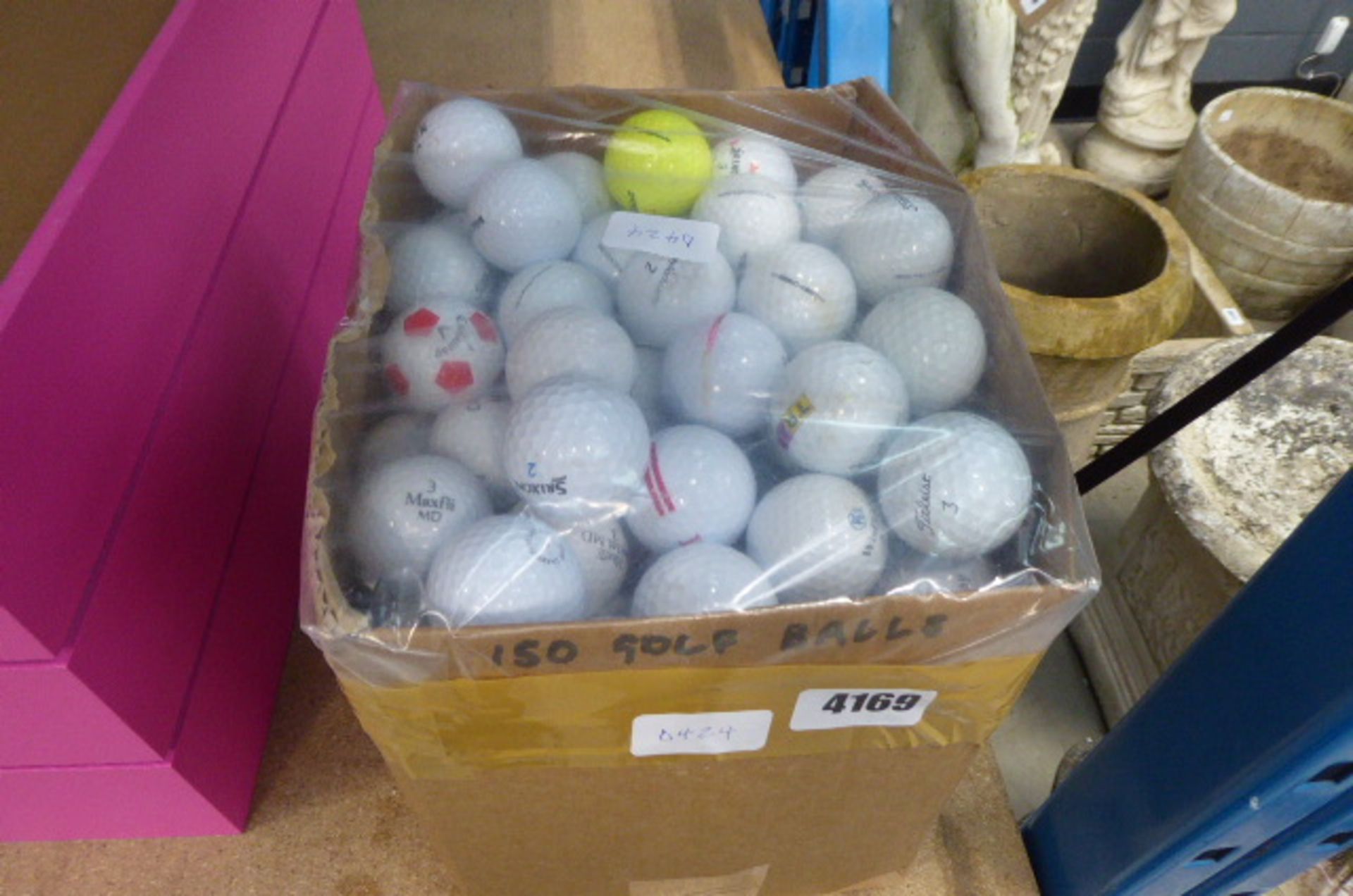 Box of assorted golf balls