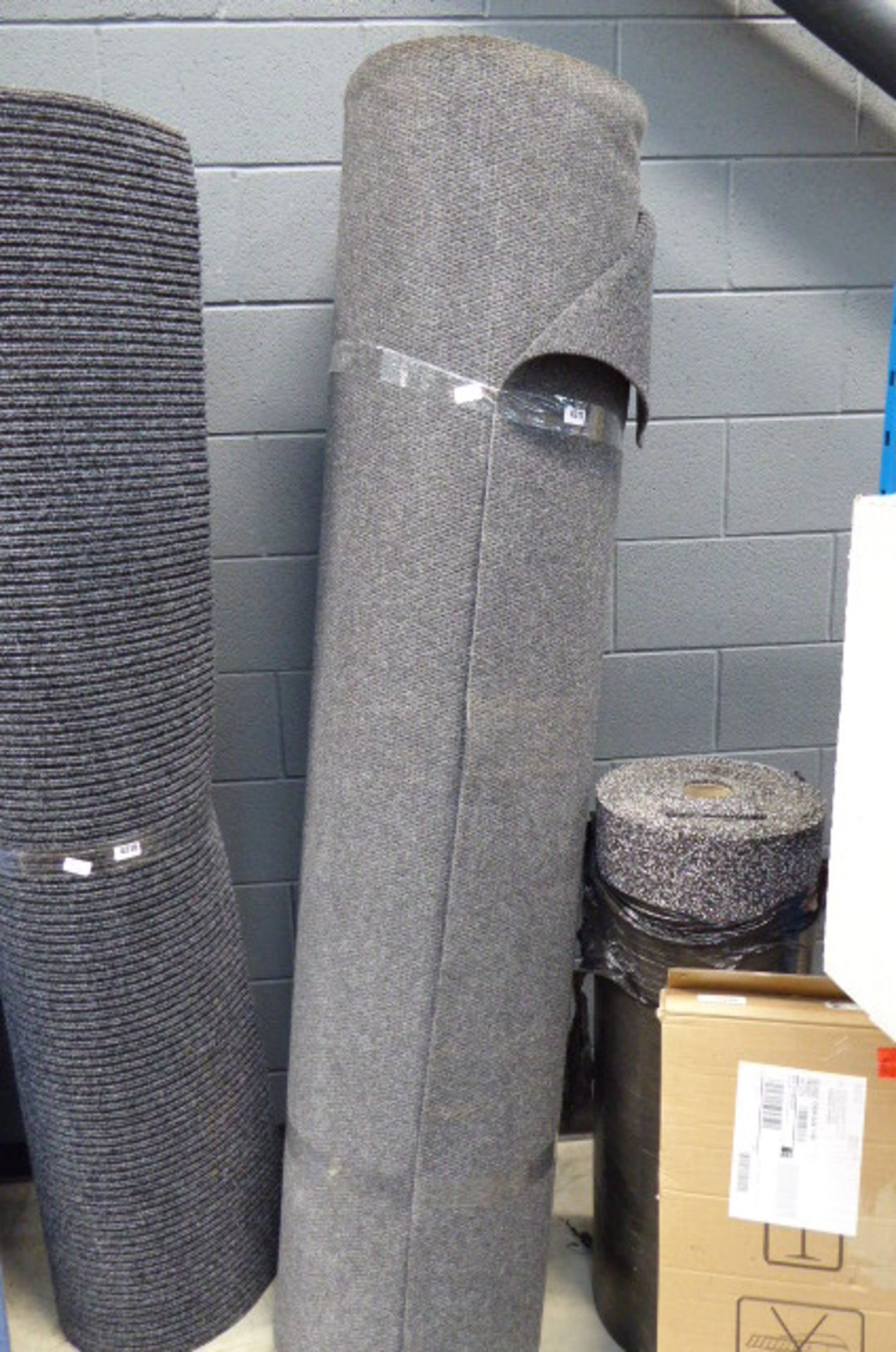 Large grey roll of heavy duty corded carpet