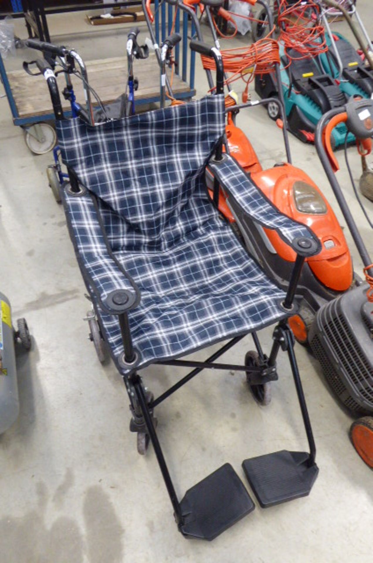 Tartan fold up wheelchair and a brown 3 wheel walking aid