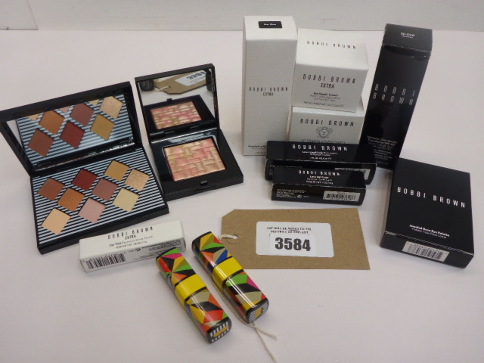 Selection of Bobbi Brown beauty products including moisture balm, enriched face base, eye