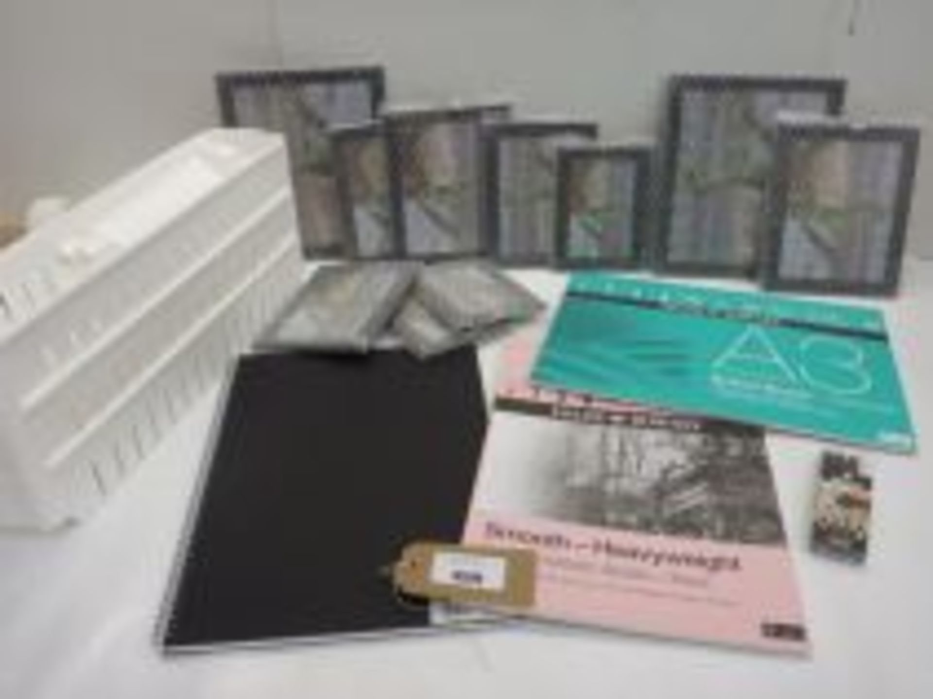 10 black glitter picture frames, 3 Daler Rowney artist sketch pads and white plastic storage rack