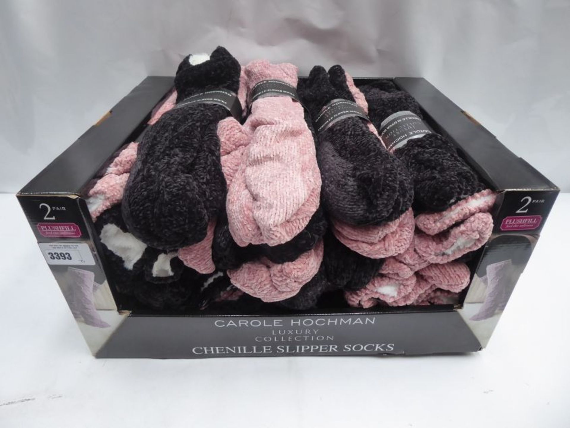 Box containing Chenille slipper socks by Carole Hochman in pink and charcoal, 24 x twin pack per