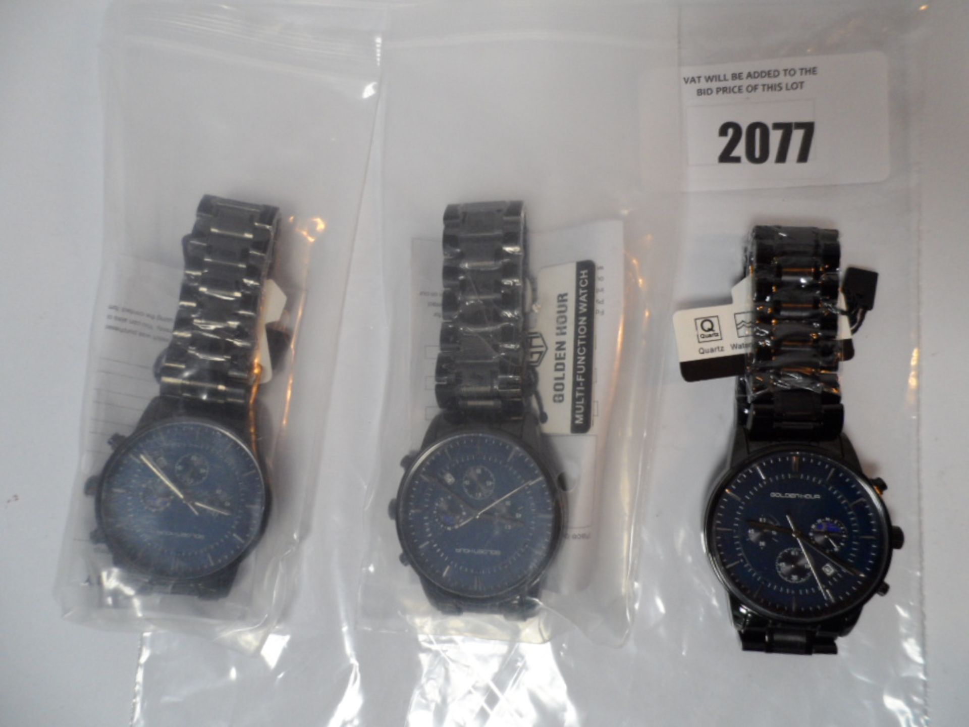 Three Golden Hour watches black metal strap with dark blue dial.