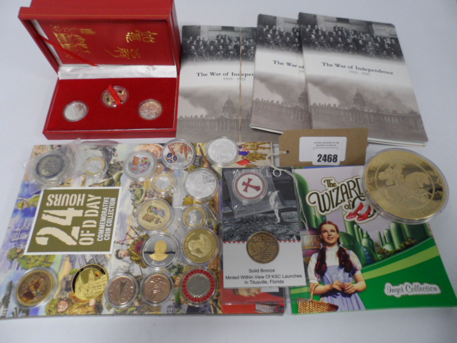 Bag containing various coin collector starter packs, novelty coins and cases.