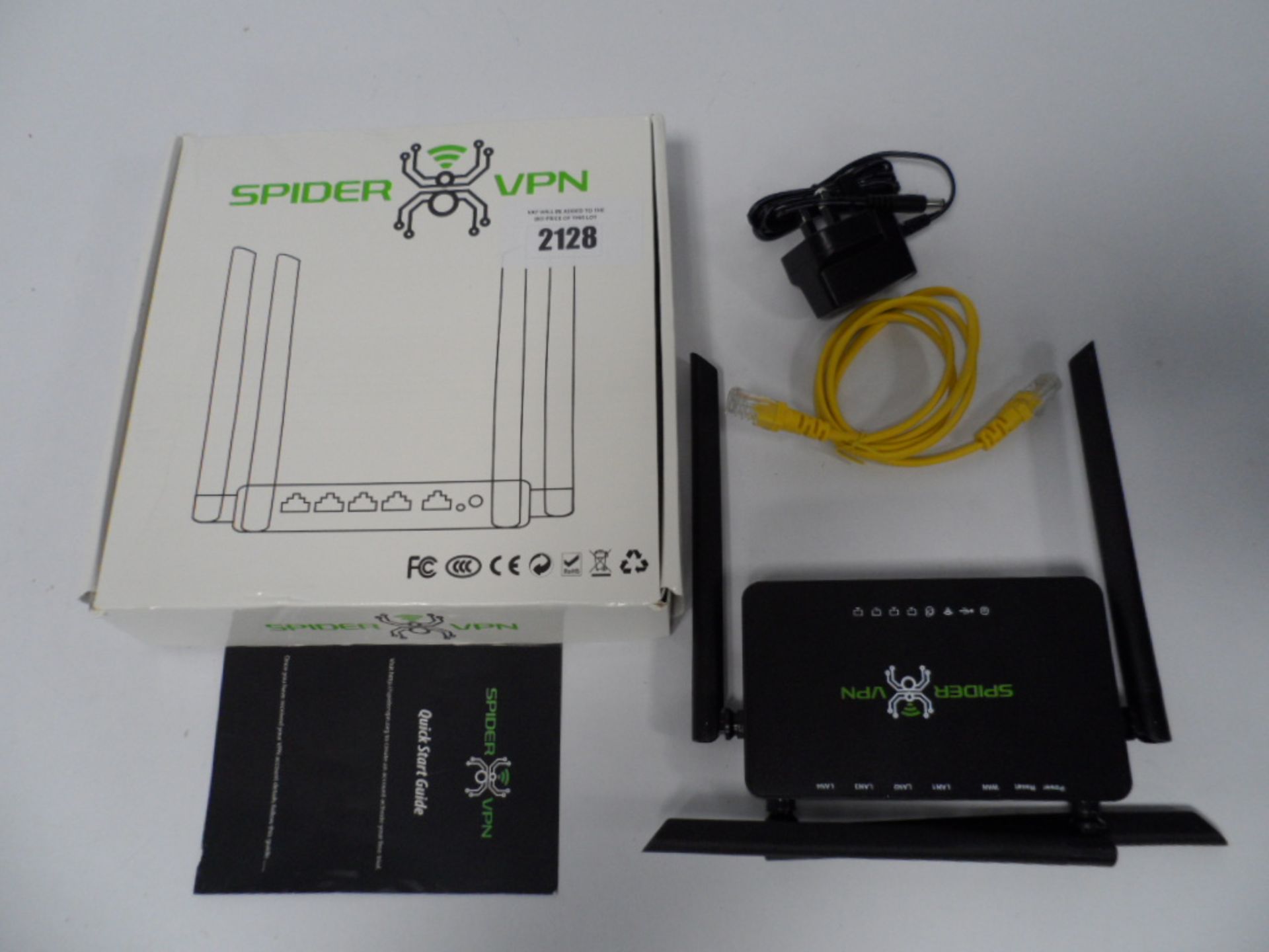 Spider VPN router boxed with power supply and network cable.