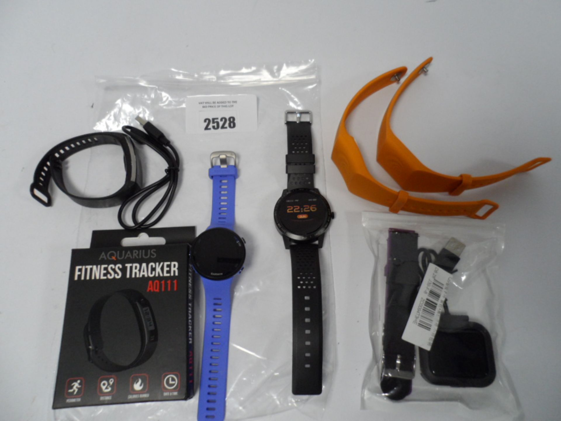 Bag of smart/fitness tracking watches and two Sea Tags.