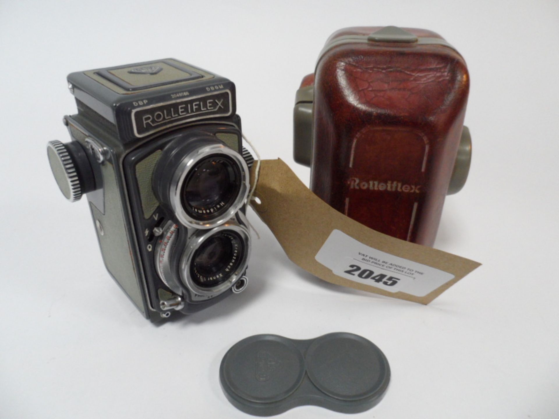 RolleiFlex 4x4 DBP DBGM Medium Format Vintage camera with lens cover and case.