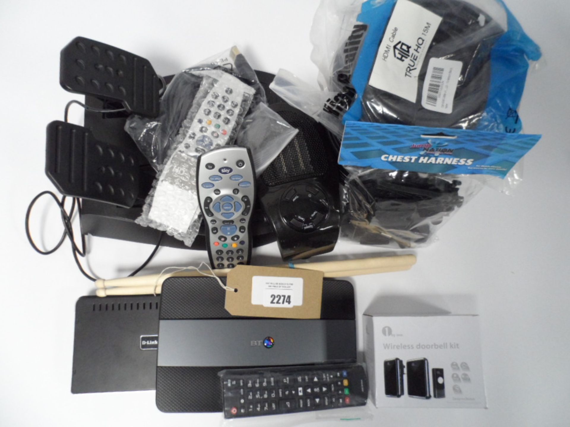 Bag of loose electrical items including remote controls, D-link Router, wireless doorbell kit, etc.