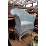 Blue painted wicker armchair