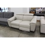 Cream leather effect 2 seater electric reclining sofa