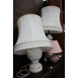 Pair of cream glazed table lamps with silk shades plus a pink glazed lamp