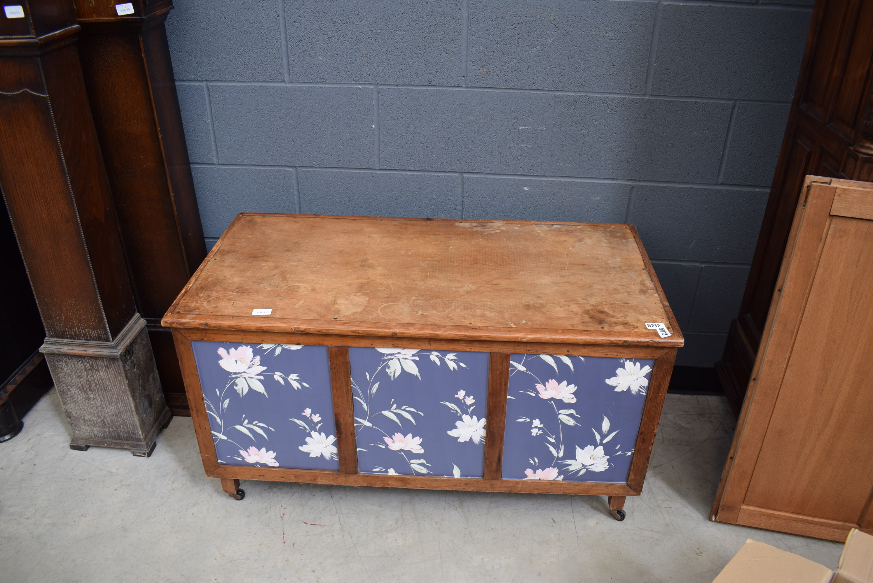 5212 A lift top blanket box with floral wallpapered panels