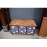 5212 A lift top blanket box with floral wallpapered panels