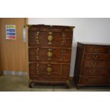 25RR A Korean elm and brass mounted cabinet having four small drawers above three pairs of doors