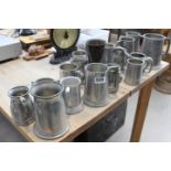 Large collection of pewter ale mugs