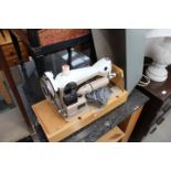 Cased Pinnock electric sewing machine