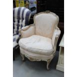 Cream and gilt painted French armchair in peach and cream fabric