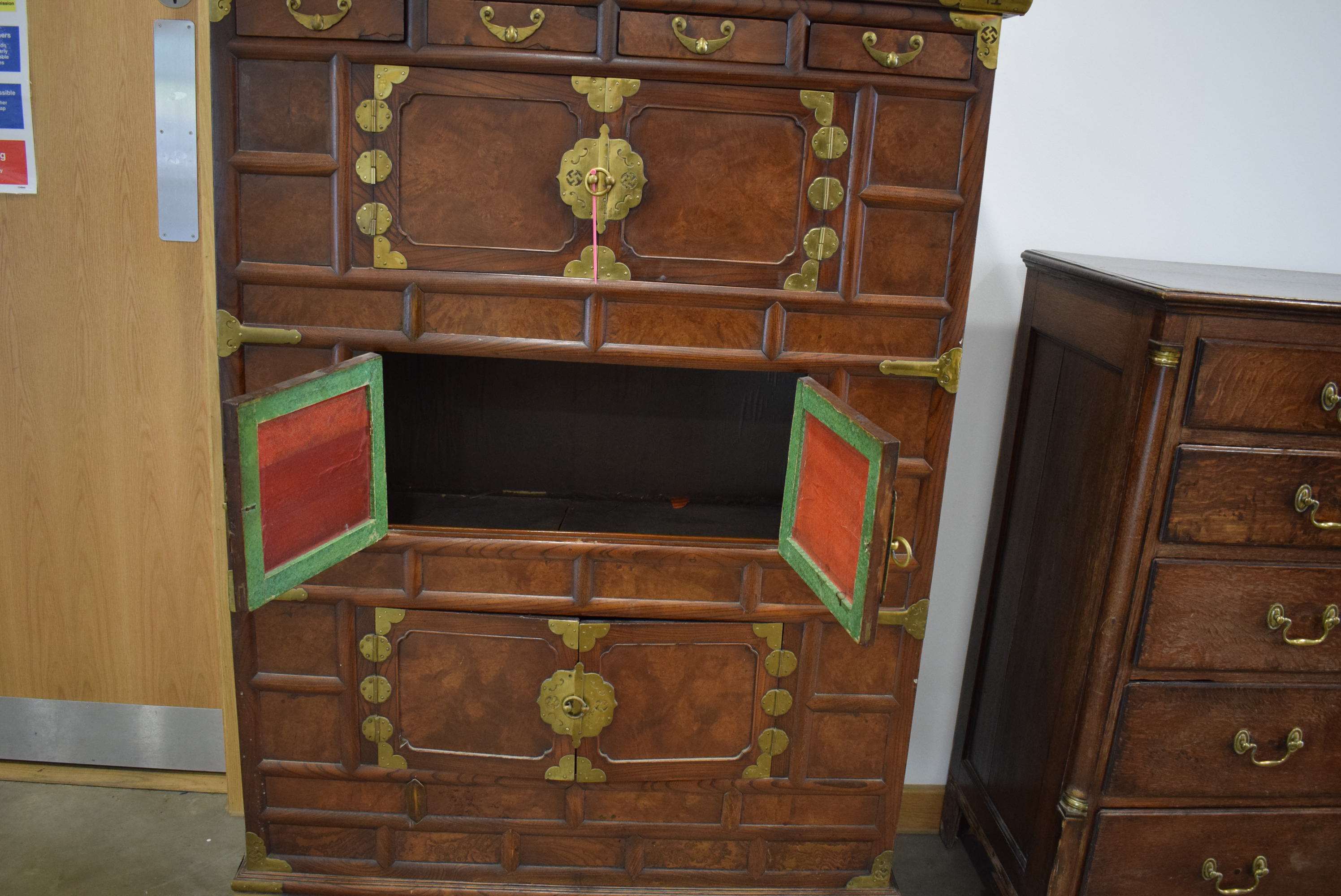 25RR A Korean elm and brass mounted cabinet having four small drawers above three pairs of doors - Image 3 of 6