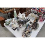 Quantity of china figures to include a fisherman, elephant, ladies, swan and Capo de Monte