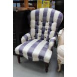 Button back armchair in striped fabric