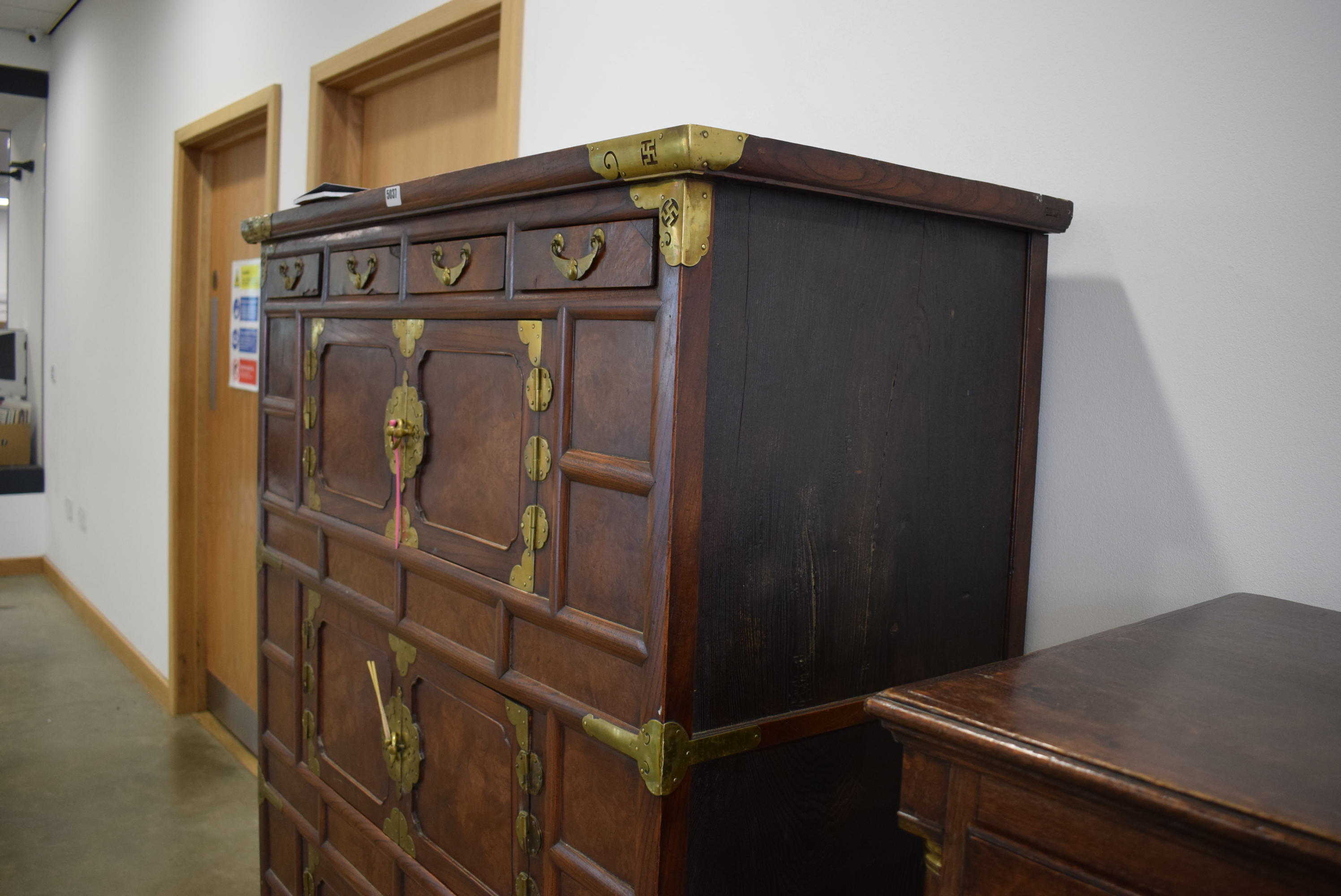 25RR A Korean elm and brass mounted cabinet having four small drawers above three pairs of doors - Image 6 of 6