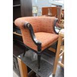 Dark painted tub chair with gilt and red patterned fabric