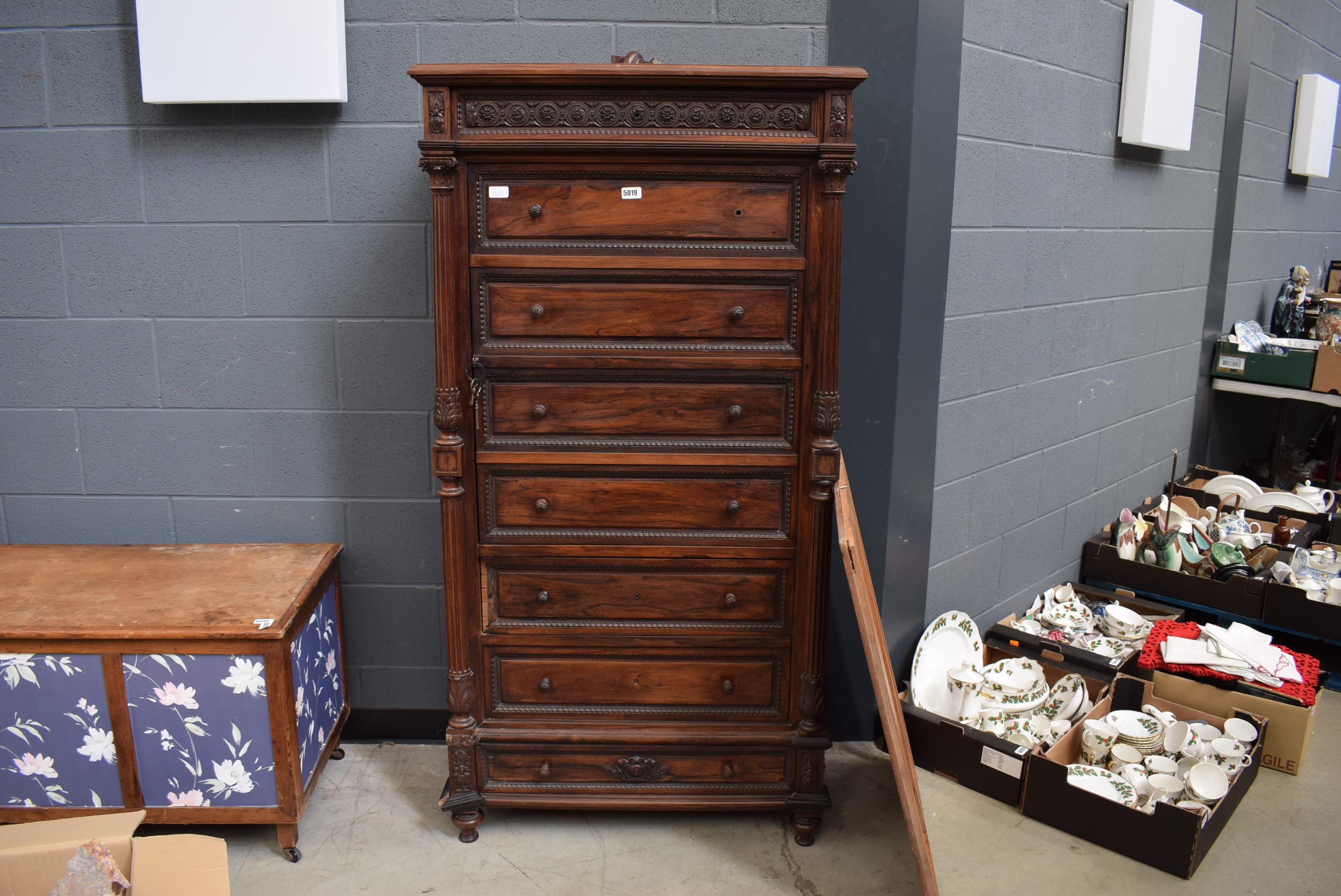 A narrow Continental rosewood cabinet converted from a chest of drawers