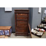 A narrow Continental rosewood cabinet converted from a chest of drawers