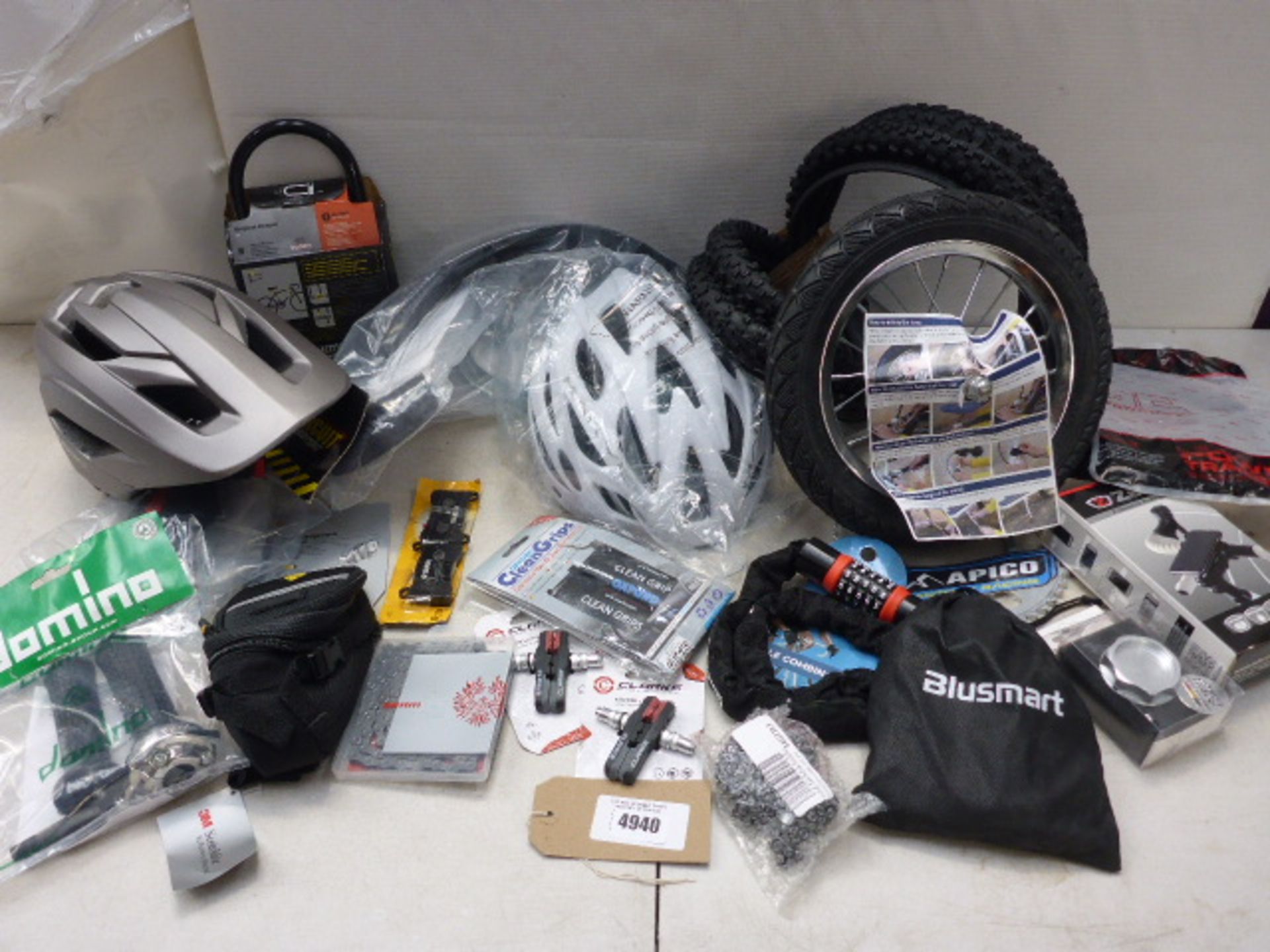 Bag containing cycle helmets, Kryptonite lock, Z console for iPhone, spockets, tyres, brake pads and