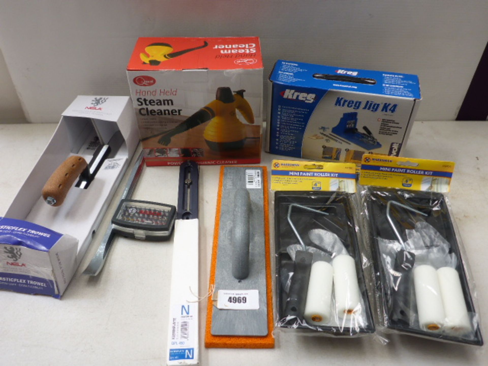 Hand held steam cleaner, Kreg jig kit, plastic flex trowel, flat sponge and paint roller sets
