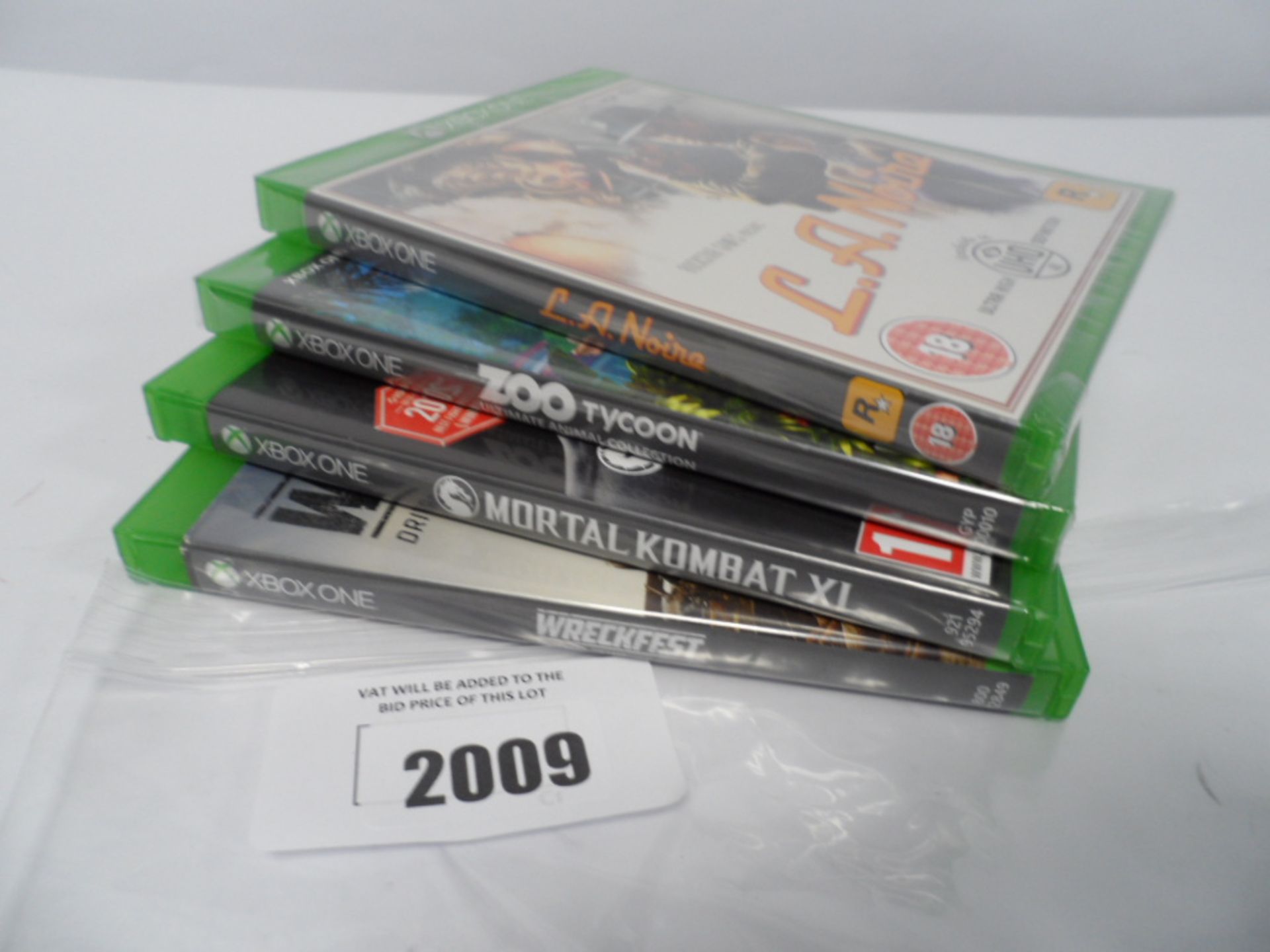 Four Xbox one games Wreckfest, Zoo tycoon, L.A Noire, Mortal Kombat XL.