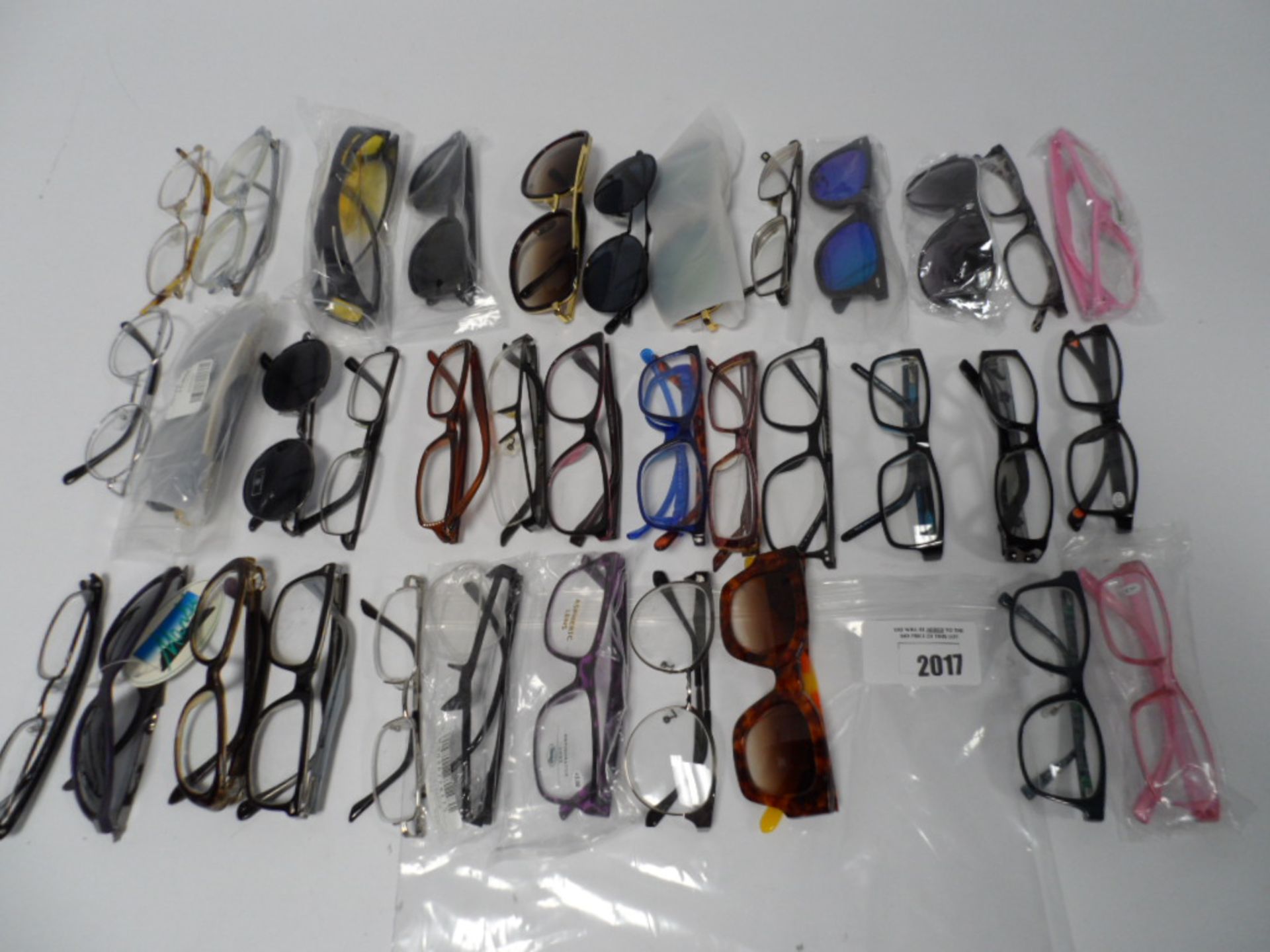 Bag containing various loose glasses and sunglasses.