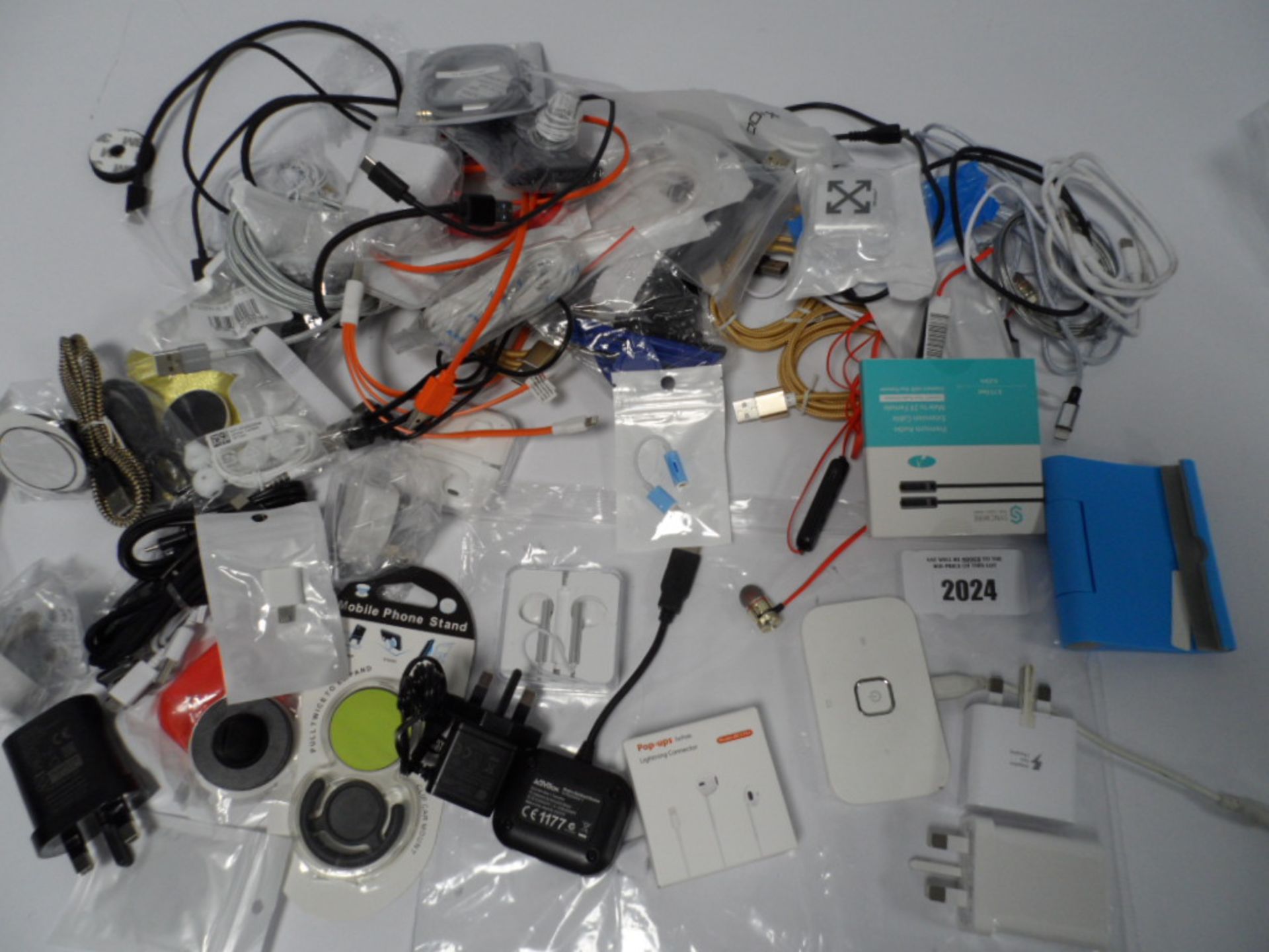 Bag of mobile phone cables, earphones, chargers, etc.