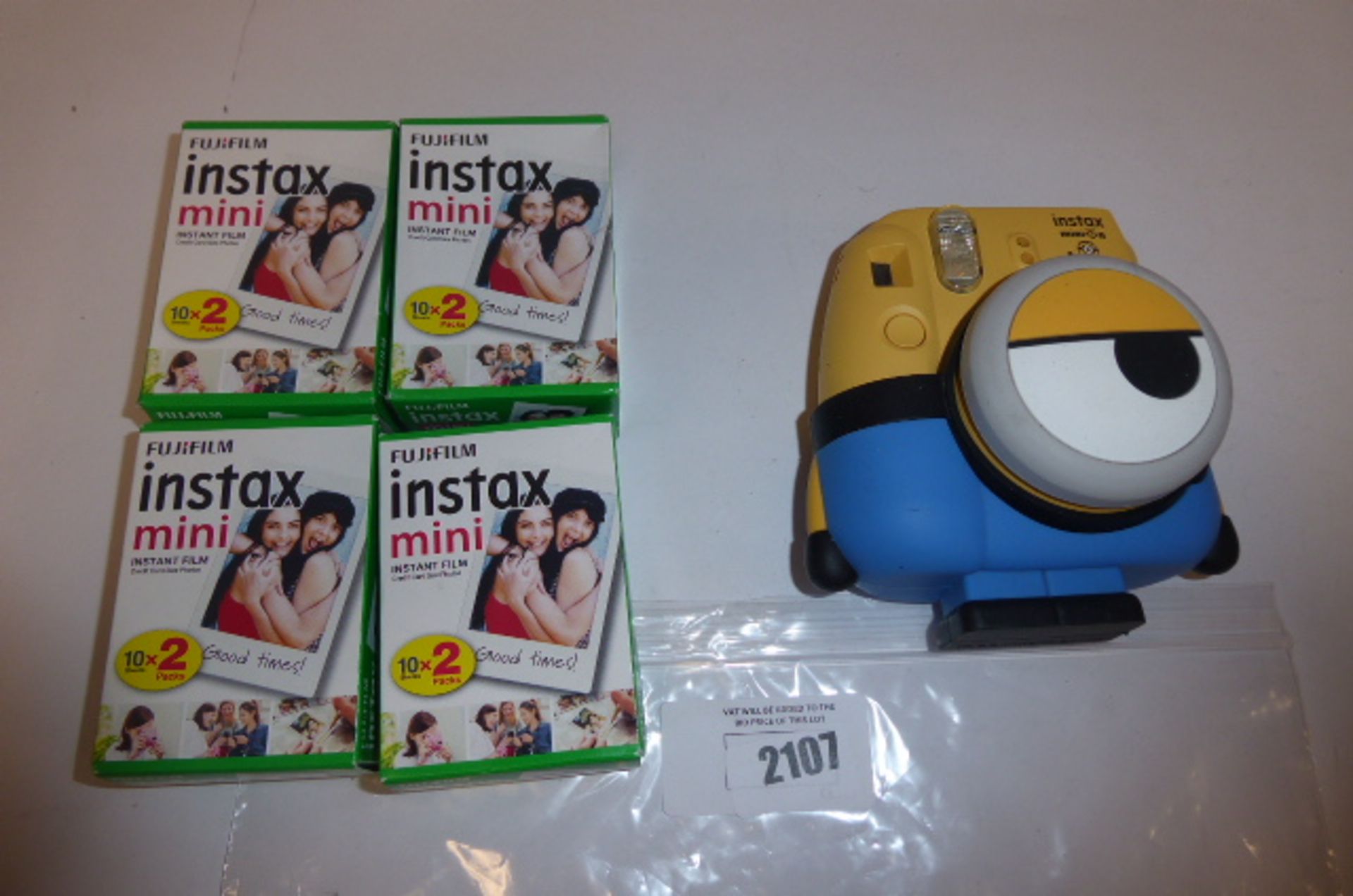 Fuji film Instax mini 8 Minion Themed camera with Four Packs of instax mini Photo paper.