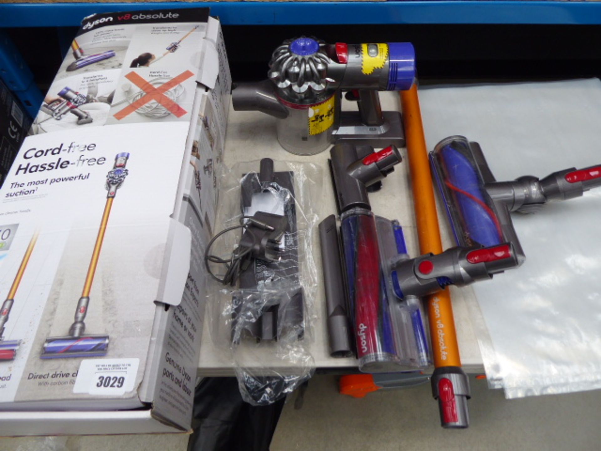 Handheld Dyson V8 Absolute with accessories to include 2 brusheads, pole, 2 small heads, charger and