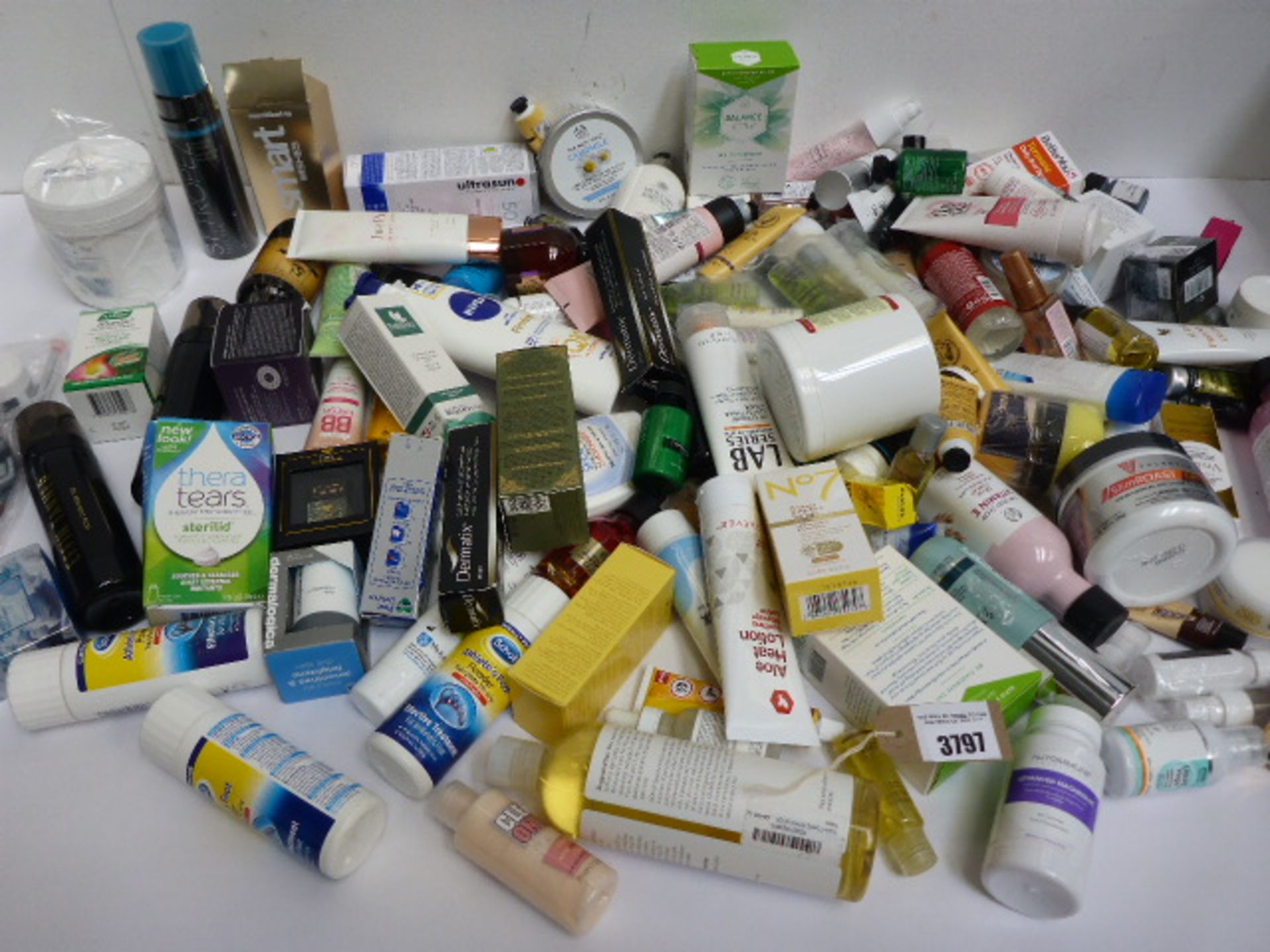 Large bag of toiletries including serum, balm, moisturizer, body oil, cleansing butter, self tan