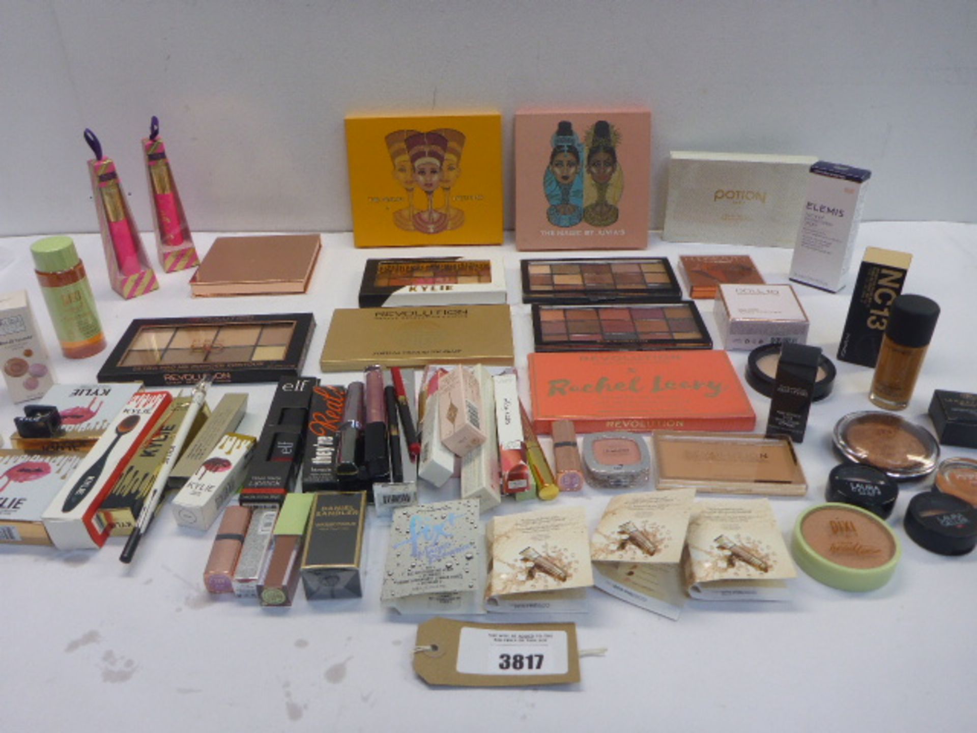 Bag of branded cosmetics including Doll 10, Tarte, Revolution, Pixi, Barry M and more