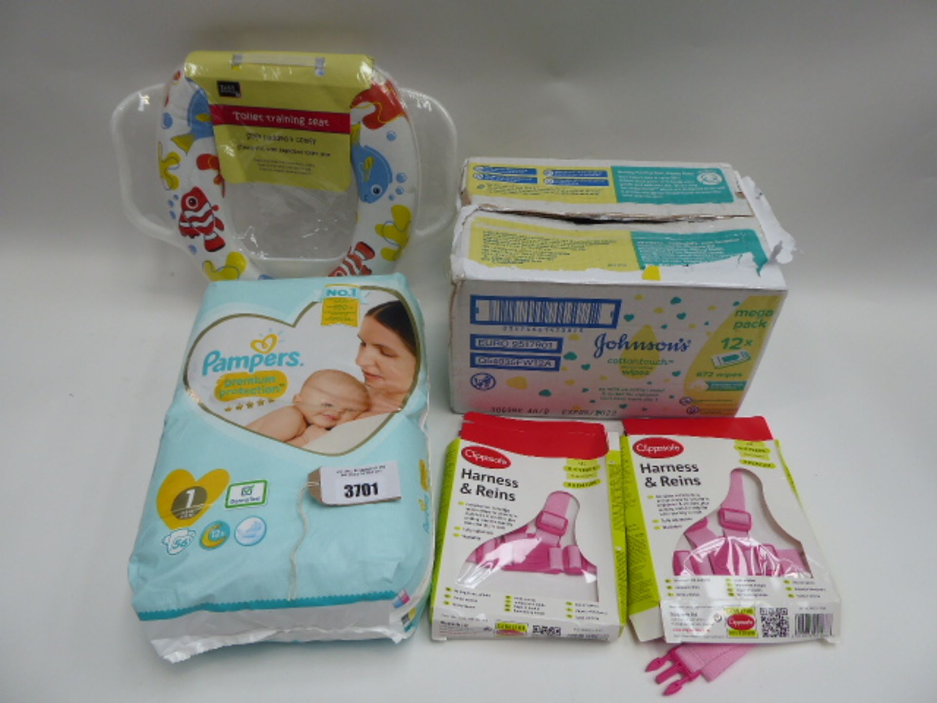 Box of 10 packs of Johnson's cottontouch wipes, Pampers 1 nappies, toilet training seat and 2x