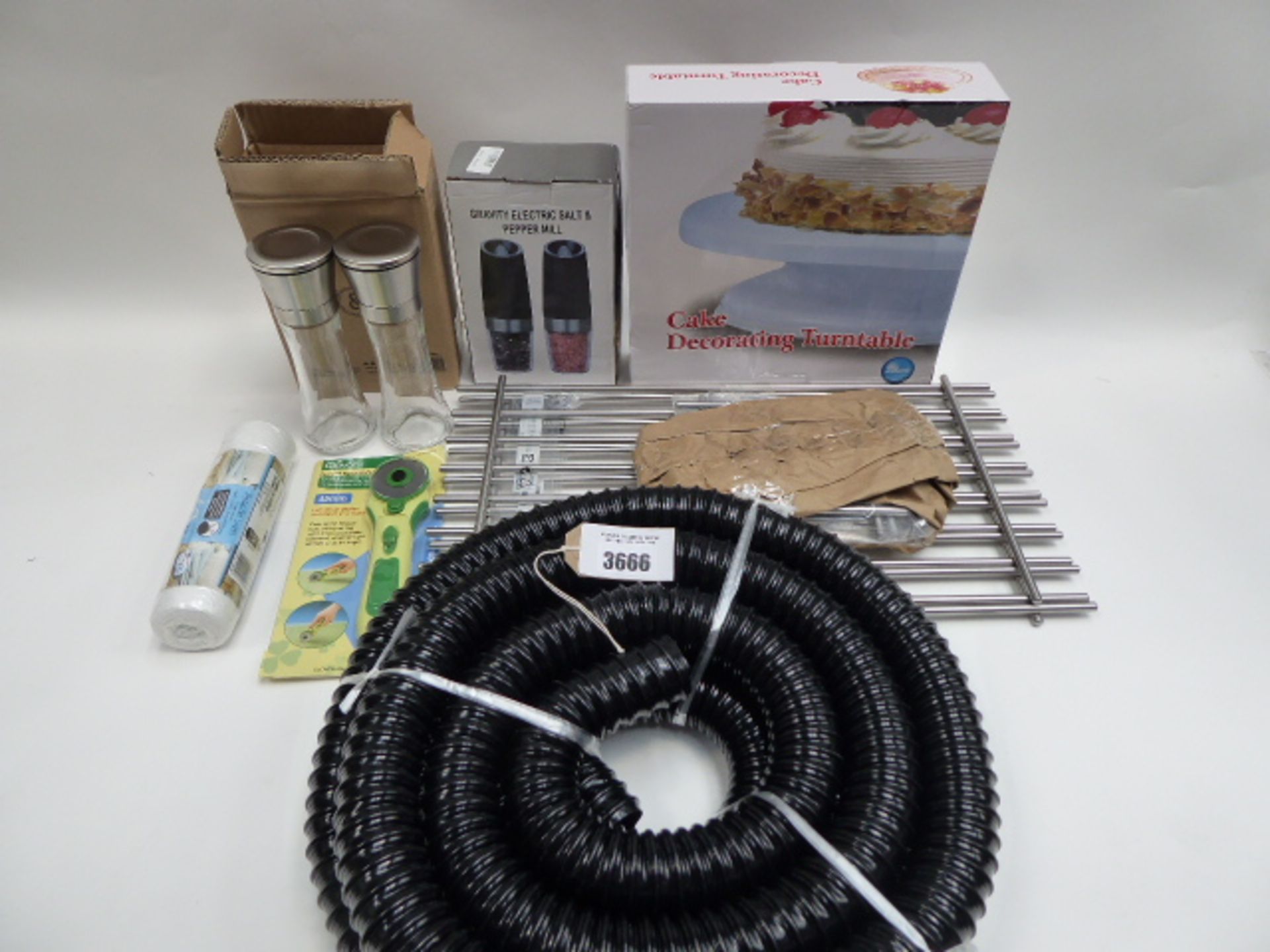 Cake decorating turntable, hose, stainless steel trivet, salt and pepper mill, clover rotary cutter