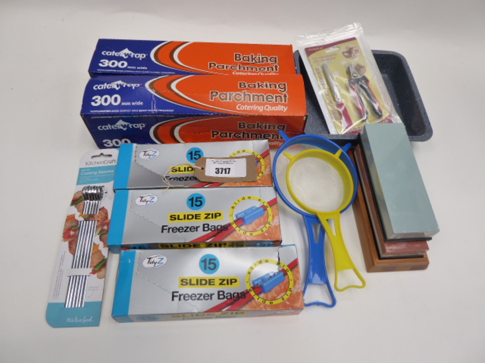 Baking partchment, slide zip freezer bags, knife sharpening tool, tray etc