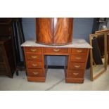 A marble topped dressing table