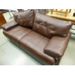5210 A brown leather effect three seater sofa