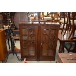 A walnut and oak glazed cabinet