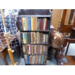 Narrow open fronted bookcase with a qty of novels