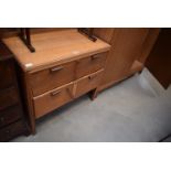 A mid 20th century oak dressing table and a matching two door wardrobe