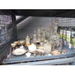 A cage of decanters, carved Black Forrest style bear, cruet set, silver plated egg cups,